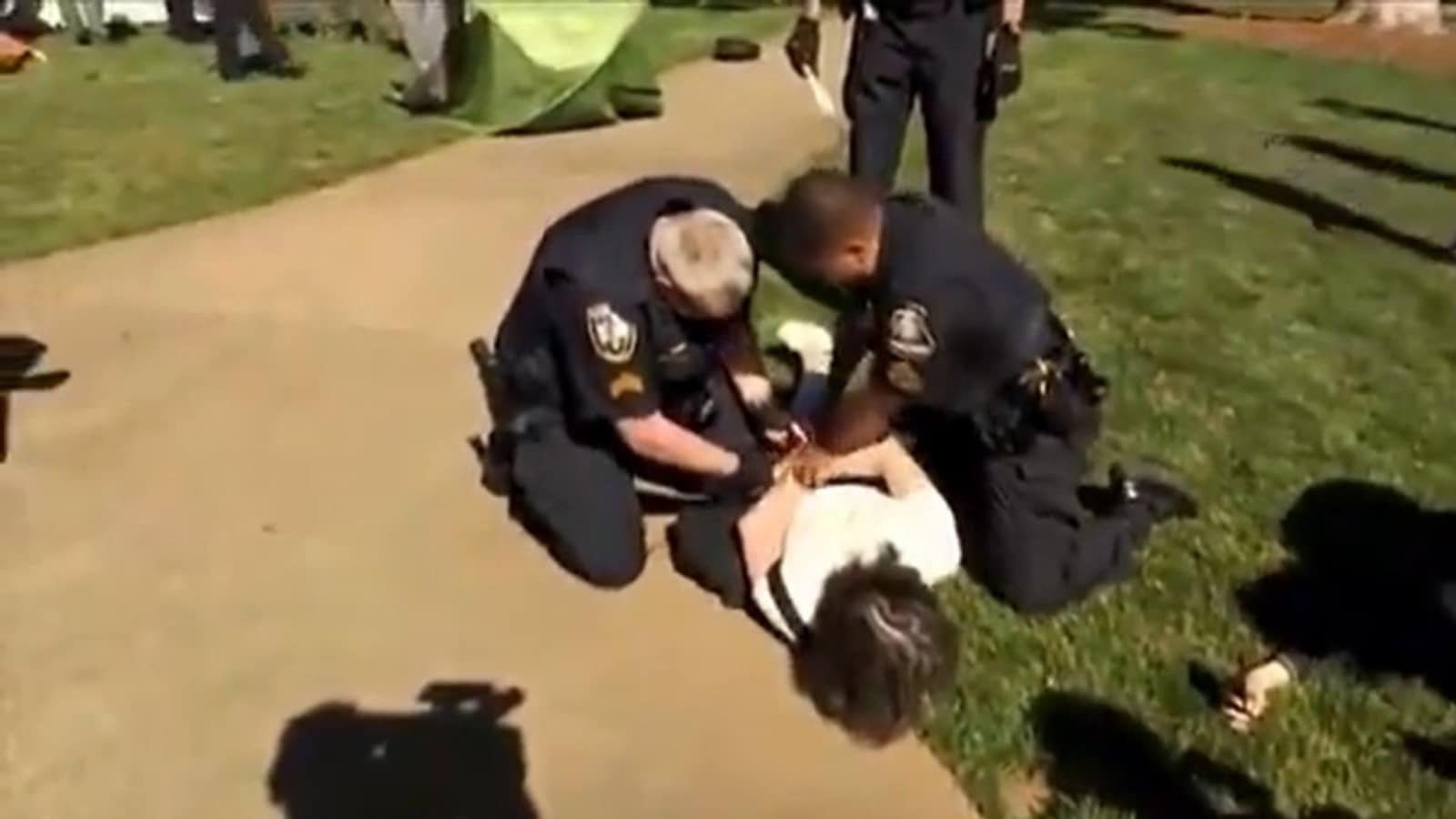 A video captured the moment when Georgia State police forcefully pushed a professor to the ground and put handcuffs on them during a protest supporting Palestine.